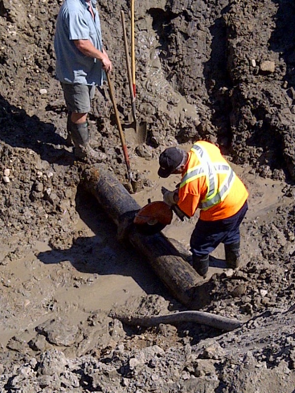 Men at work in the L lot pit.