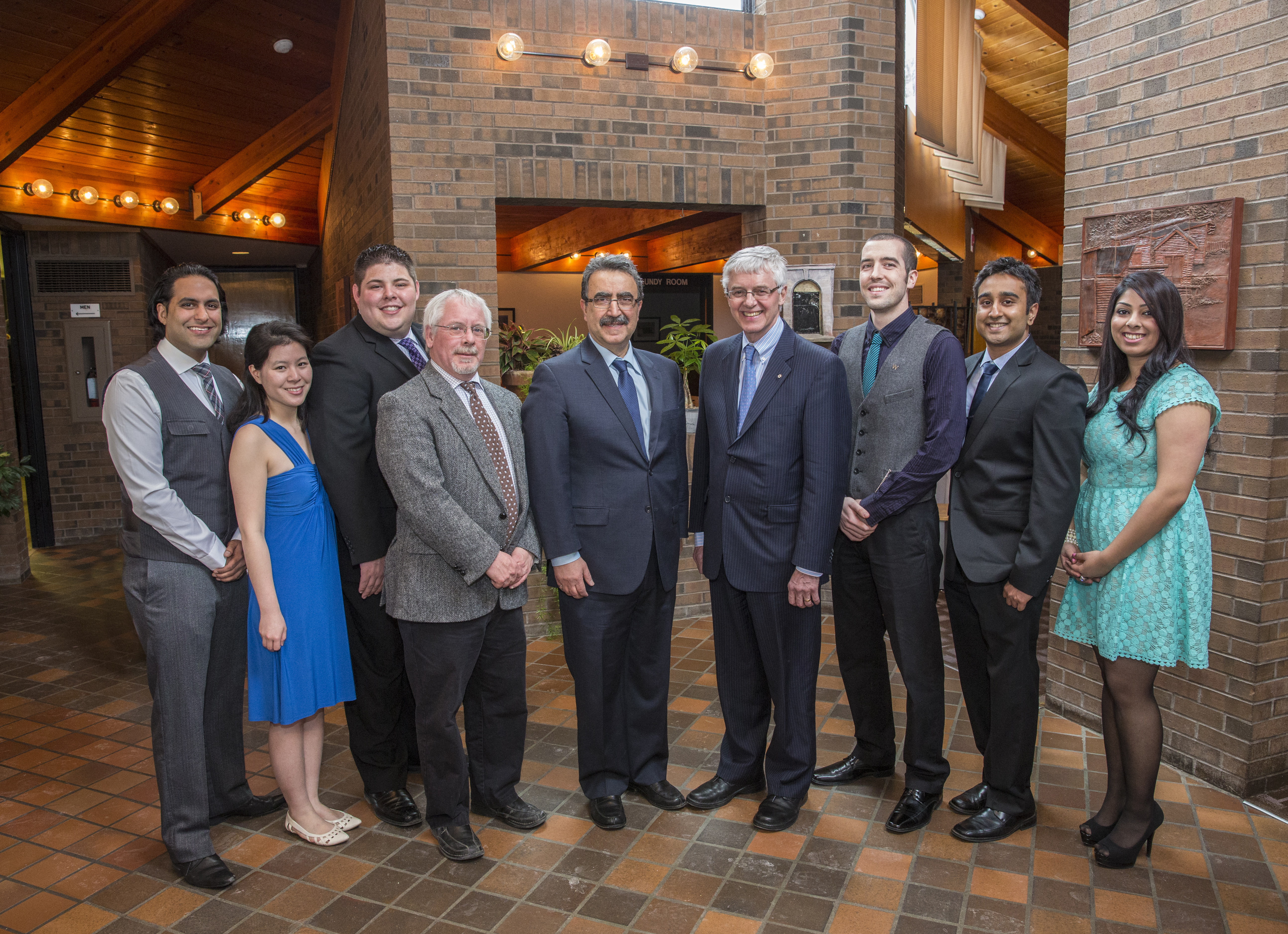 Master of Public Service students pose with Dean of Arts Doug Peers, President Feridun Hamdullahpur, and Kevin Lynch.