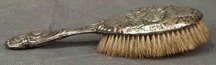 [Silver hairbrush]