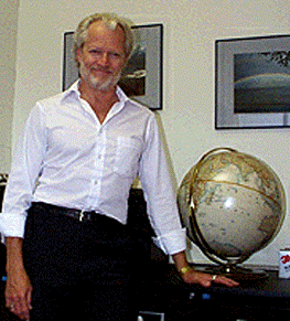 [Sloan with globe]