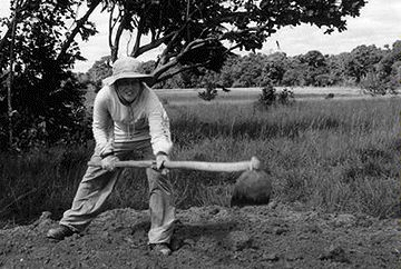 [Wielding a mattock]