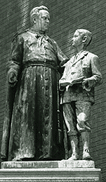 [Statue, priest with boy]