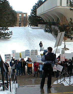 [At the foot of the NH steps]