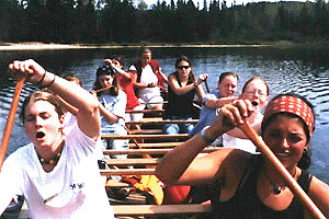 [Women paddling, except flute player]