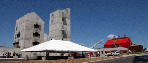 [Towers, red barn, tent in the middle]