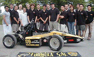 [Posing with yellow and black car]