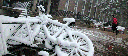 [White bike, red jacket]