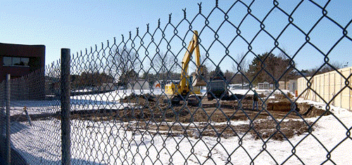 [Through the chain link fence]