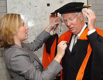 [Adjusting soft hat, orange gown]