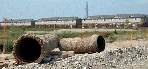 [Townhouses, muddy pipes]