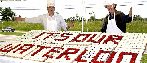 [Two chefs behind the array]