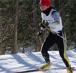 [Red hat, yellow-and-black ski pants]