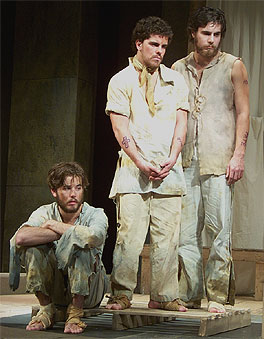 [Three men in shabby attire]