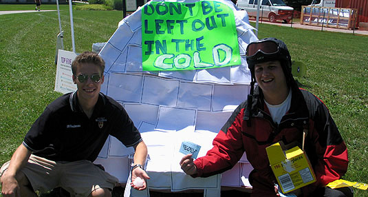 [Cardboard igloo in front of sunny lawn]