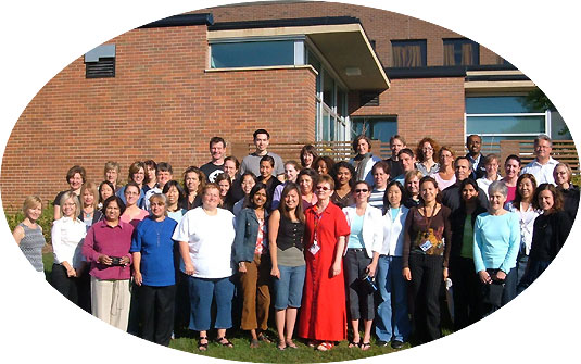 [Group posing outside Lyle Hallman Institute building]