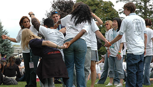 [A tangle of arms, T-shirts and jeans]