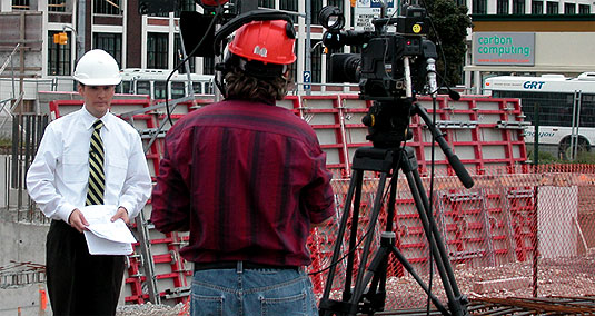 [White hard hat in the middle of construction site]