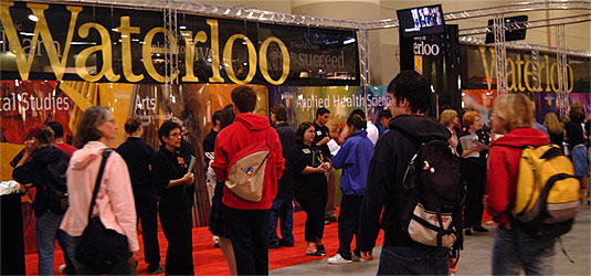 [Waterloo logos dominate long display area]