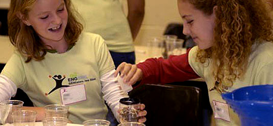 [Two young ladies intent on experiment]