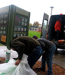 [Sign, truck and workers]