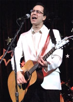 [Guitarist in white dinner jacket]