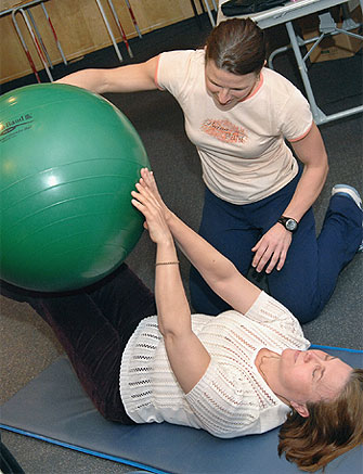 [Giant green ball on her knees]