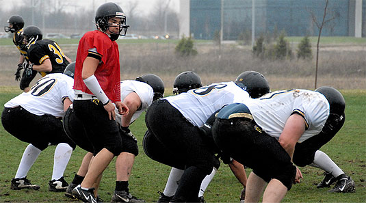 [Lineup for scrimmage, rear view]