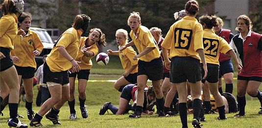 [Women in action in gold uniforms]