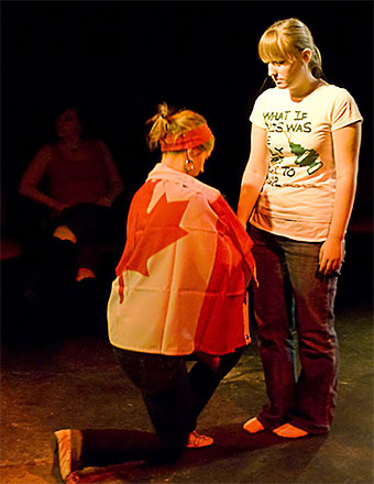 Woman with flag is kneeling]