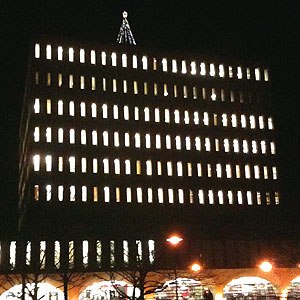 [Dana Porter Library at night, topped by Christmas tree]