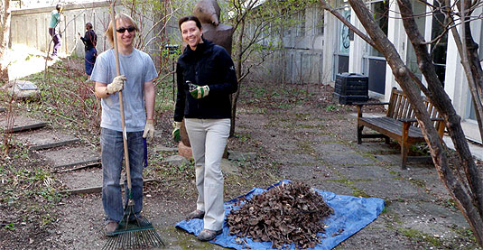 [Two people, one rake]