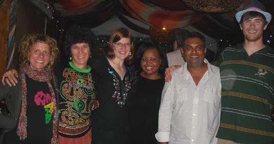 Campbell, Weaver, and students pose with South African musicians