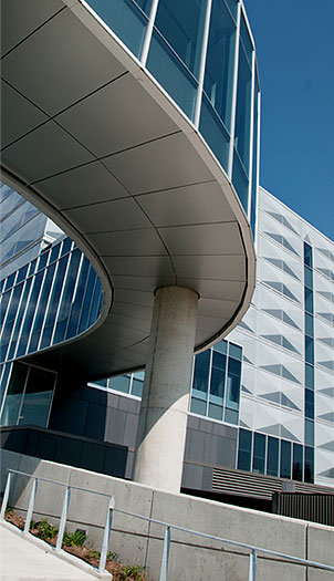 [View of curving overpass and building exterior]