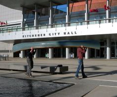 Canoe carried past Kitchener City hall
