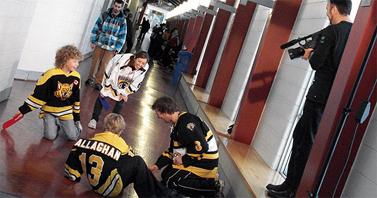 [Cameraman overlooks floor hockey game]