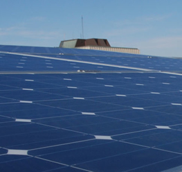 The Dana Porter Library is visible behind the solar panel array atop Environment 3.