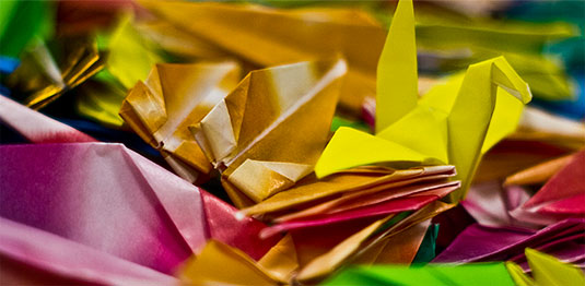 [Multicoloured paper cranes]