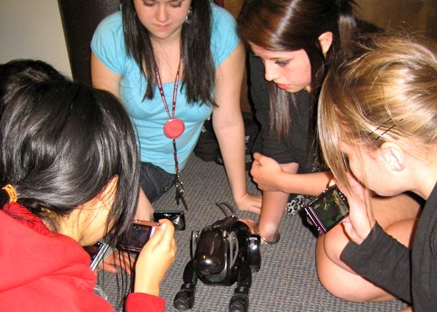 Girls programming robot dog 