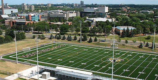 [High-angle view, main campus in background]