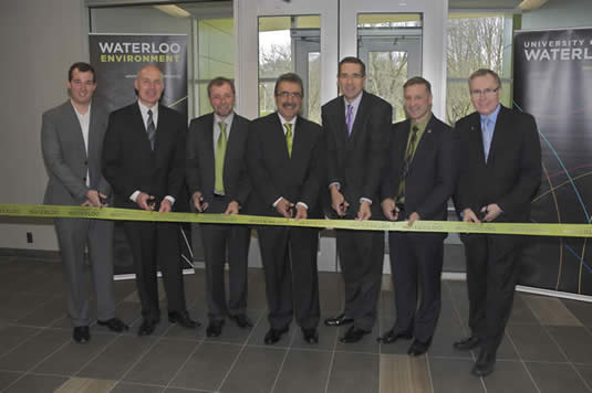 Key participants cut the ceremonial ribbon at the Environment 3 building.