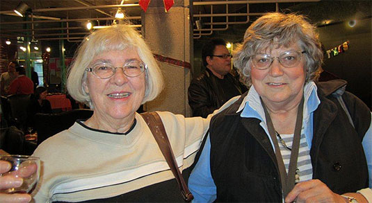 Library staffers Joyce Cummings and Baiba Gomes Turner.