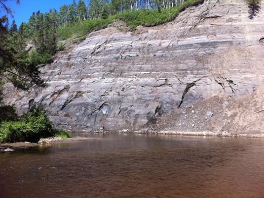 The photo of a bitumen layer along the Athabasca River by Mike Morin, President of Wood Buffalo Helicopter.