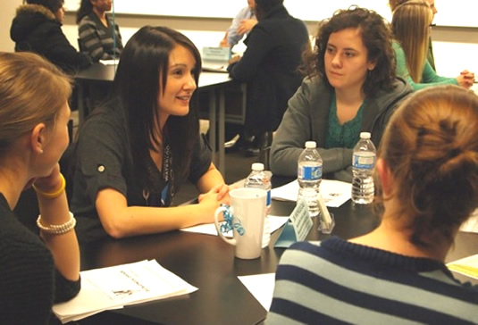 Students ask questions of AHS alumna Dr. Michelle Cali.