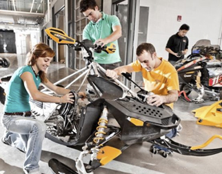 Students from the Clean Snowmobile Team work on a snowmobile.