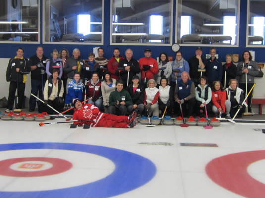 A group shot of curlers on the ice at a Hagey Funspiel
