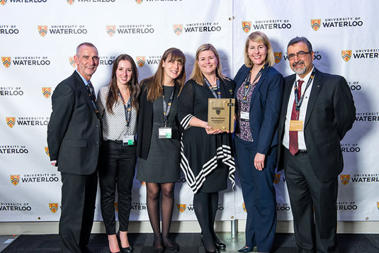 The RBC student team poses with President Feridun Hamdullahpur and Vice-President, Academic and Provost Ian Orchard as they accept their Top Employer Award.