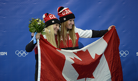 Kaillie Humphries and Heather Moyse celebrate their Olympic win.