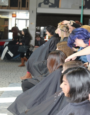 Students get their hair cut in the SLC Great Hall.
