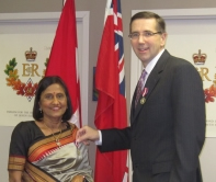 Chandrika Anjaria and John Milloy at the medal presentation ceremony.