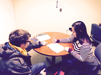 Students working at a table.